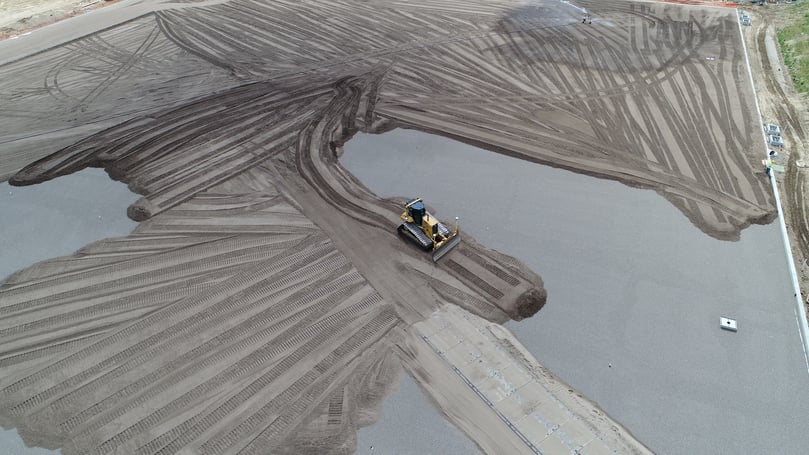 GPS Dozer Spreading Dirt on UTS Fnished Rock